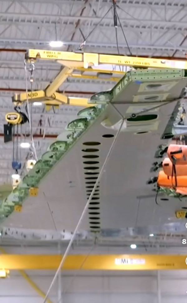Business jet wing assembly in a production hangar