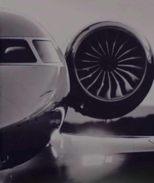 Close-up of a business jet turbofan engine on the tarmac
